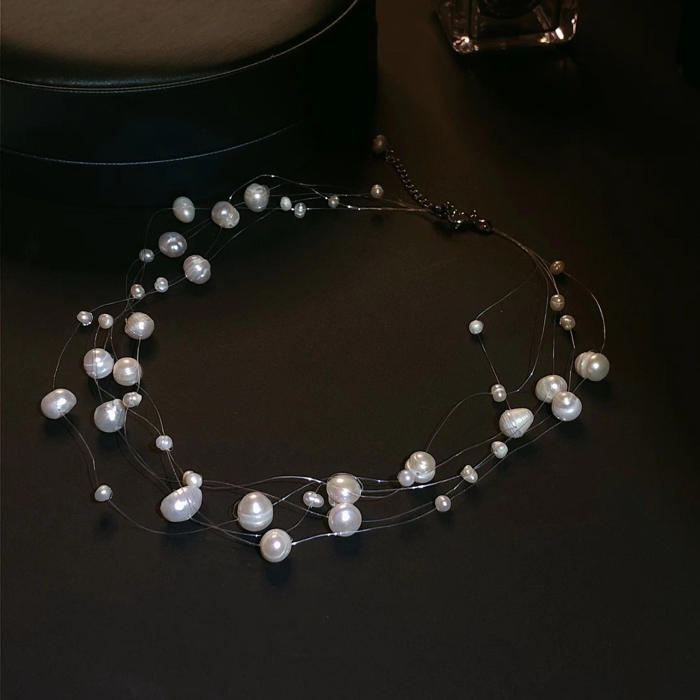 Floating Freshwater Pearl Bridal Choker with genuine freshwater pearls suspended on transparent strands, creating an elegant floating illusion around the neckline.