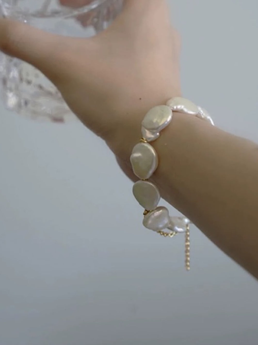 Luminous Baroque Pearl Coin Beads Bracelet with irregular freshwater baroque pearls and delicate golden chain details.