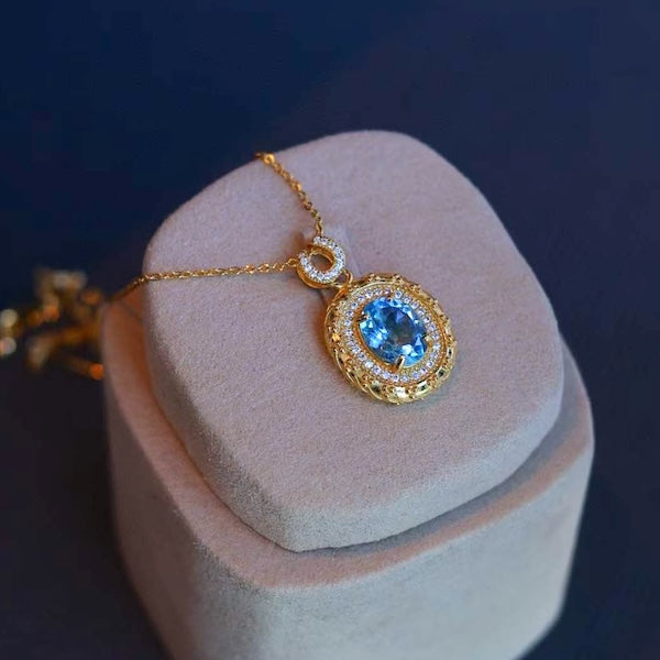 Blue Topaz Gold Framed Oval Pendant Necklace 