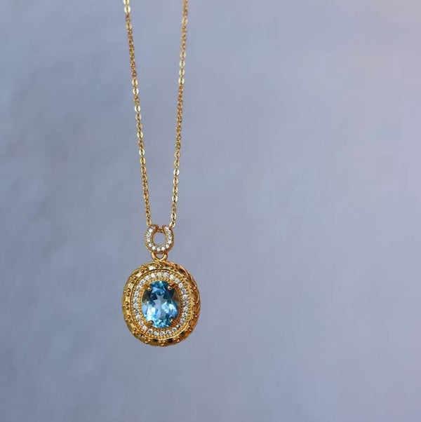 Blue Topaz Gold Framed Oval Pendant Necklace 