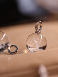 Clear Quartz Reindeer Necklace featuring a genuine clear quartz crystal pendant with a delicate reindeer motif suspended from a sterling silver chain.