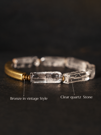 Clear Quartz Bar Bracelet featuring genuine clear quartz stone bars, bronze-toned findings, and a vintage-inspired charm.
