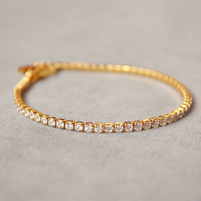 Timeless Diamond-Look Tennis Bracelet featuring a continuous row of premium-grade zirconia set in a classic gold-tone tennis bracelet design.