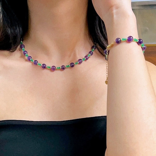 Enchanted Amethyst & Green Onyx Jewelry Set featuring genuine purple amethyst beads and green onyx accents in a matching necklace and bracelet design.

