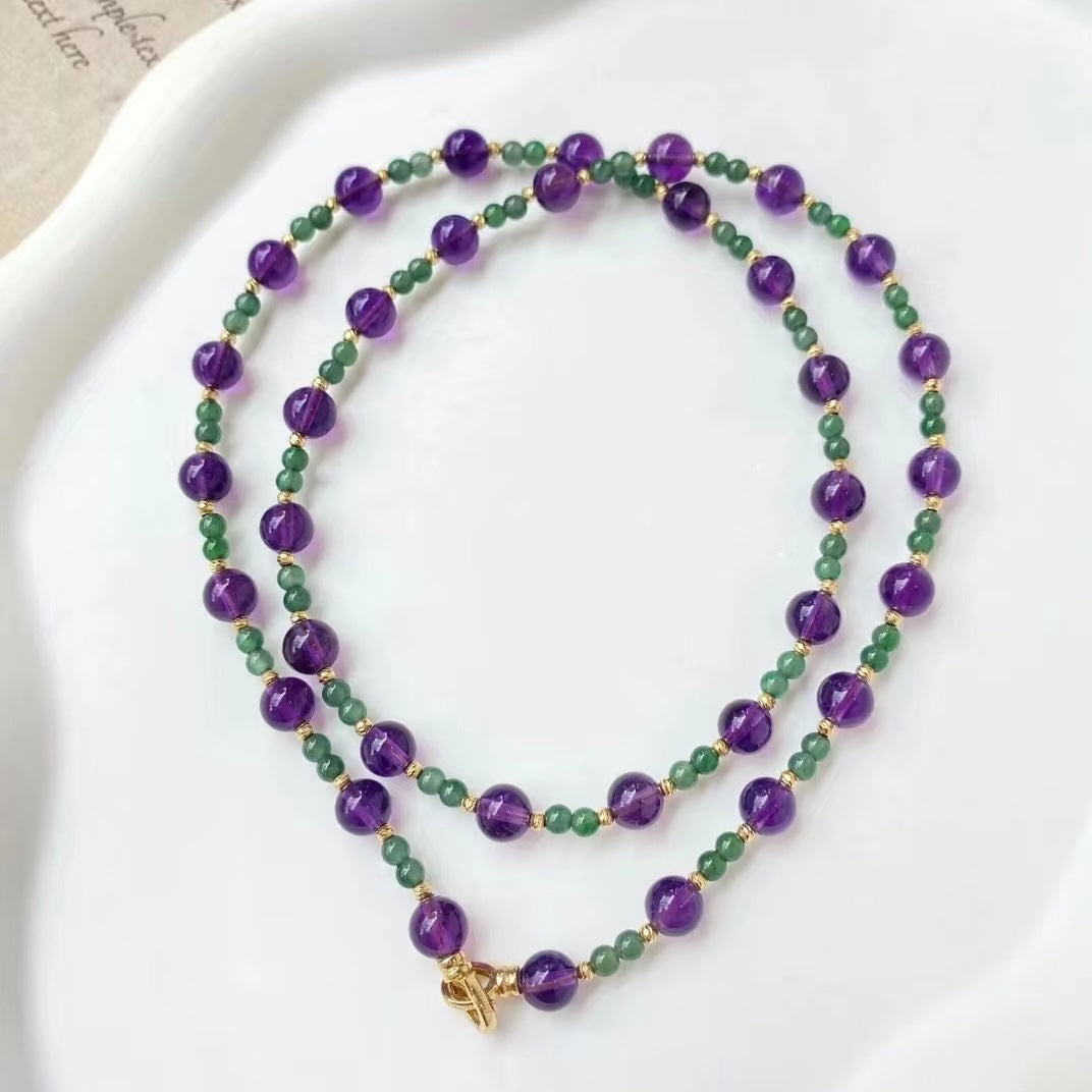 Enchanted Amethyst & Green Onyx Jewelry Set featuring genuine purple amethyst beads and green onyx accents in a matching necklace and bracelet design.
