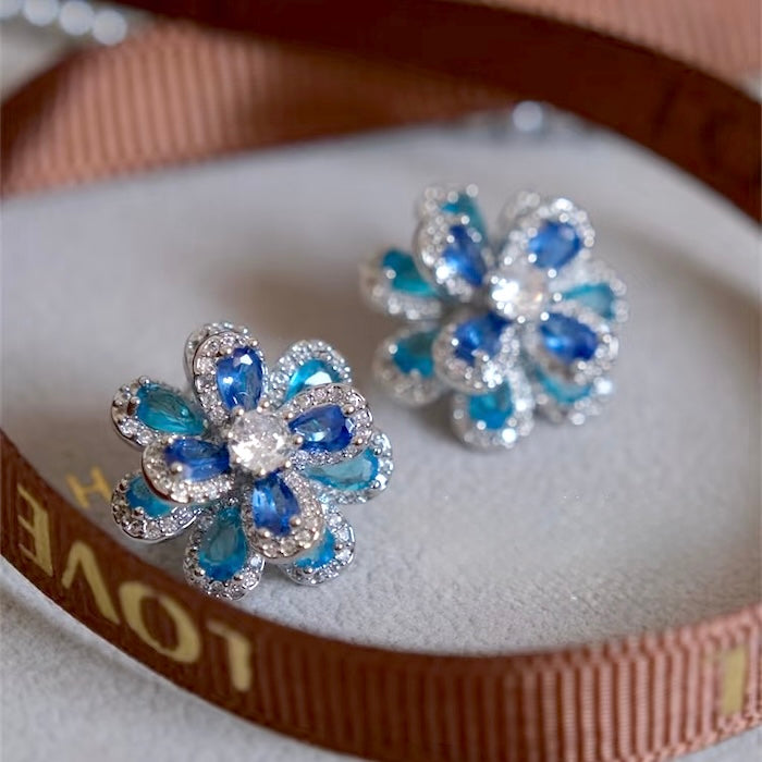 Azure Oil Painting Floral Jewelry Set featuring sapphire-blue and aqua crystal flowers with sparkling premium-grade zirconia in a matching pendant necklace, stud earrings, and adjustable ring.