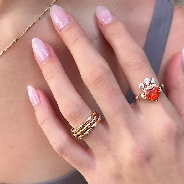 Layered Bamboo Style Adjustable Ring featuring multiple bamboo-inspired gold-tone bands stacked into a bold adjustable ring design.
