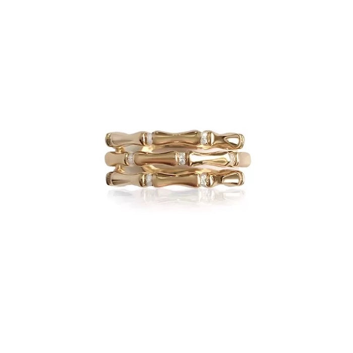 Layered Bamboo Style Adjustable Ring featuring multiple bamboo-inspired gold-tone bands stacked into a bold adjustable ring design.
