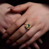 Royal Style Sky Blue Stone Ring featuring a sparkling sky-blue center stone surrounded by zirconia accents in a gold-plated vintage-inspired halo design.
