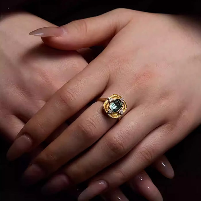 Royal Style Sky Blue Stone Ring featuring a sparkling sky-blue center stone surrounded by zirconia accents in a gold-plated vintage-inspired halo design.
