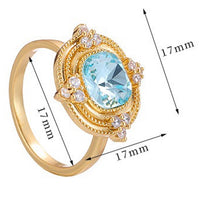 Royal Style Sky Blue Stone Ring featuring a sparkling sky-blue center stone surrounded by zirconia accents in a gold-plated vintage-inspired halo design.
