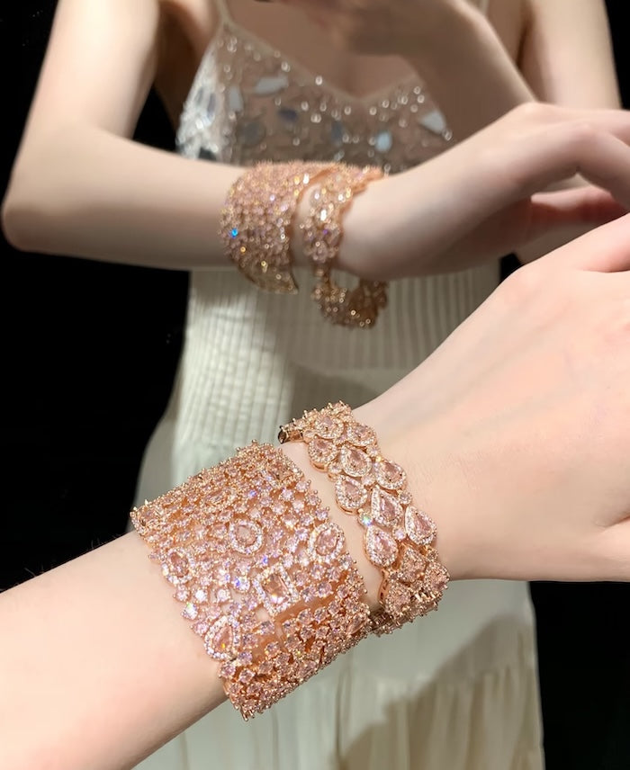 Blush Diamond Couture Jewelry Set featuring an open rose gold-plated cuff bangle, matching tennis bracelet, and cascading chandelier earrings adorned with brilliant blush pink stones.