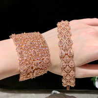 Blush Diamond Couture Jewelry Set featuring an open rose gold-plated cuff bangle, matching tennis bracelet, and cascading chandelier earrings adorned with brilliant blush pink stones.