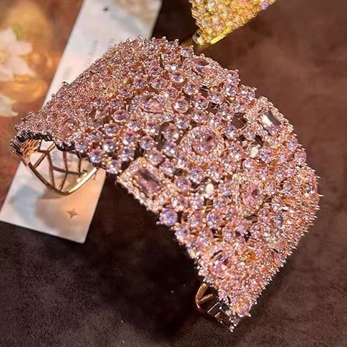 Blush Diamond Couture Jewelry Set featuring an open rose gold-plated cuff bangle, matching tennis bracelet, and cascading chandelier earrings adorned with brilliant blush pink stones.