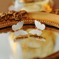 Iridescent Butterfly Shell Stud Earrings featuring luminous shell wings and delicate zirconia accents in a butterfly-inspired gold-tone design.