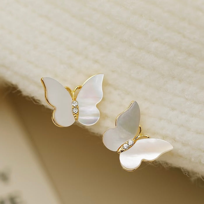 Iridescent Butterfly Shell Stud Earrings featuring luminous shell wings and delicate zirconia accents in a butterfly-inspired gold-tone design.