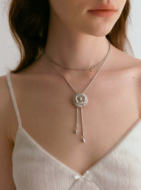 Sophisticated Silver Camellia Necklace and Earrings Set featuring delicate camellia-inspired floral details in a silver-plated finish with matching earrings.
