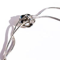 Sophisticated Silver Camellia Necklace and Earrings Set featuring delicate camellia-inspired floral details in a silver-plated finish with matching earrings.
