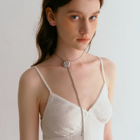 Sophisticated Silver Camellia Necklace and Earrings Set featuring delicate camellia-inspired floral details in a silver-plated finish with matching earrings.
