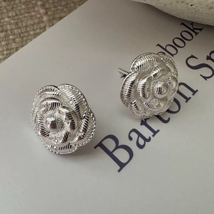 Sophisticated Silver Camellia Necklace and Earrings Set featuring delicate camellia-inspired floral details in a silver-plated finish with matching earrings.
