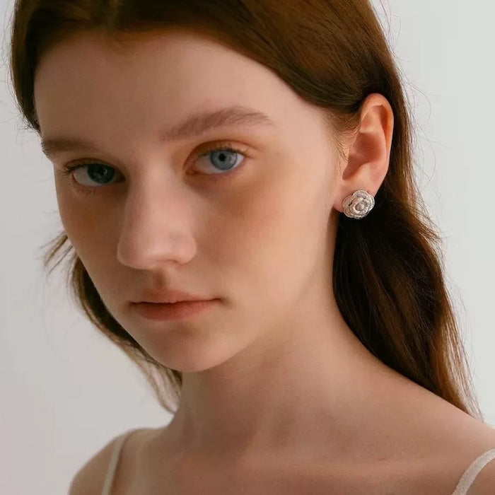 Sophisticated Silver Camellia Necklace and Earrings Set featuring delicate camellia-inspired floral details in a silver-plated finish with matching earrings.

