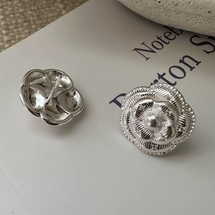 Sophisticated Silver Camellia Necklace and Earrings Set featuring delicate camellia-inspired floral details in a silver-plated finish with matching earrings.
