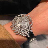 Camellia Convertible Watch Style Bracelet featuring a detachable mother-of-pearl and premium-grade zirconia centerpiece on a black PU leather strap with a luxurious watch-inspired design.