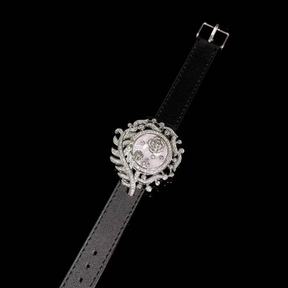 Camellia Convertible Watch Style Bracelet featuring a detachable mother-of-pearl and premium-grade zirconia centerpiece on a black PU leather strap with a luxurious watch-inspired design.