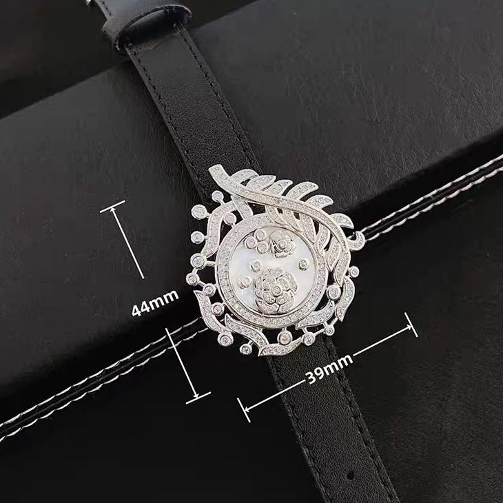 Camellia Convertible Watch Style Bracelet featuring a detachable mother-of-pearl and premium-grade zirconia centerpiece on a black PU leather strap with a luxurious watch-inspired design.