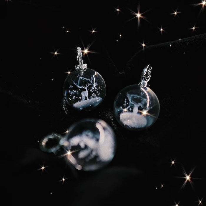 Clear Quartz Reindeer Necklace featuring a genuine clear quartz crystal pendant with a delicate reindeer motif suspended from a sterling silver chain.