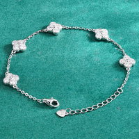 Eternal Clover Moissanite Bracelet crafted in sterling silver with five pavé-set four-leaf clover motifs adorned with brilliant moissanite stones and an adjustable chain.