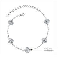 Eternal Clover Moissanite Bracelet crafted in sterling silver with five pavé-set four-leaf clover motifs adorned with brilliant moissanite stones and an adjustable chain.