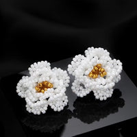 Handmade Daisy Beaded Necklace and Earrings Set featuring handwoven white daisy flowers with gold-tone accents, a 76 cm beaded necklace, and matching floral earrings.