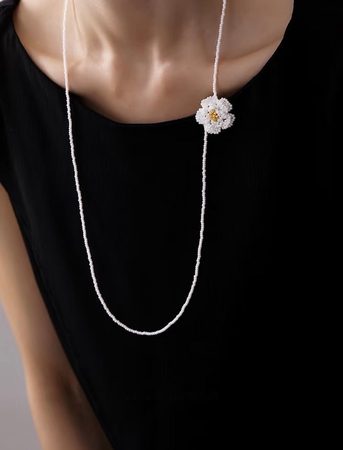 Handmade Daisy Beaded Necklace and Earrings Set featuring handwoven white daisy flowers with gold-tone accents, a 76 cm beaded necklace, and matching floral earrings.