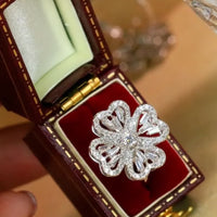 Dazzling Turning Four Leaf Clover Jewelry Set featuring rotating four-leaf clover earrings, pendant necklace, bracelet, and matching ring crafted in white gold plated brass with premium-grade zirconia.