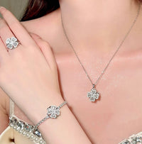 Dazzling Turning Four Leaf Clover Jewelry Set featuring rotating four-leaf clover earrings, pendant necklace, bracelet, and matching ring crafted in white gold plated brass with premium-grade zirconia.