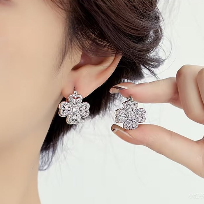 Dazzling Turning Four Leaf Clover Jewelry Set featuring rotating four-leaf clover earrings, pendant necklace, bracelet, and matching ring crafted in white gold plated brass with premium-grade zirconia.