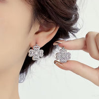 Dazzling Turning Four Leaf Clover Jewelry Set featuring rotating four-leaf clover earrings, pendant necklace, bracelet, and matching ring crafted in white gold plated brass with premium-grade zirconia.