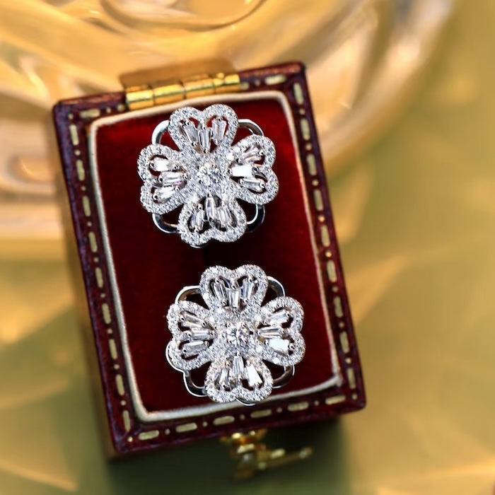 Dazzling Turning Four Leaf Clover Jewelry Set featuring rotating four-leaf clover earrings, pendant necklace, bracelet, and matching ring crafted in white gold plated brass with premium-grade zirconia.