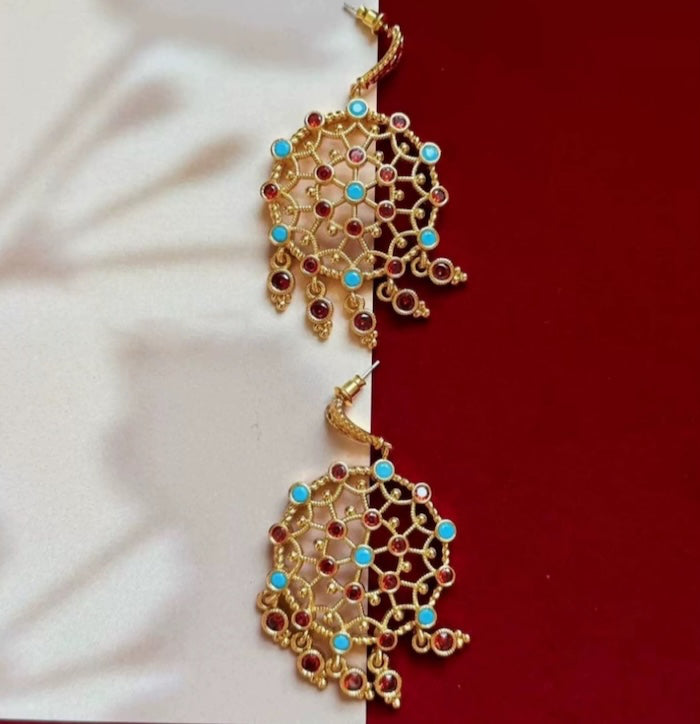 Vintage Dream Catcher Drop Earrings featuring intricate gold-tone openwork details with red and turquoise crystal accents in a statement drop design.
