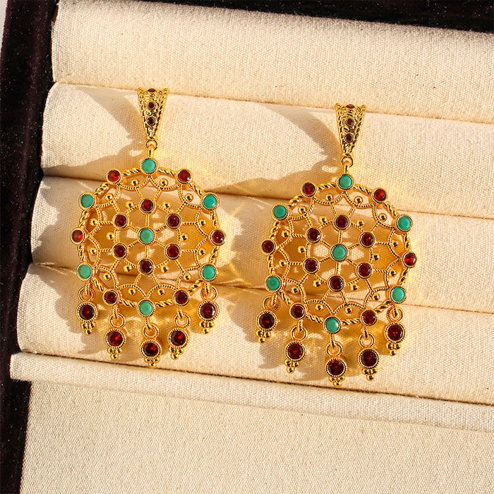 Vintage Dream Catcher Drop Earrings featuring intricate gold-tone openwork details with red and turquoise crystal accents in a statement drop design.
