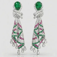 Emerald Ribbon Cascade Earrings with an emerald green teardrop crystal, silver-plated finish, sparkling zirconia, ribbon-inspired detailing, and crystal tassels.