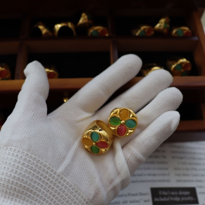 Vintage Colorful Flower Dome Ring featuring multicolor petal-shaped stones arranged in a floral pattern within a gold-tone dome setting.
