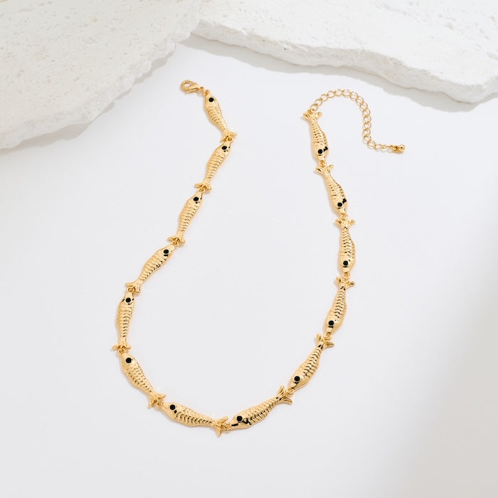 Vintage Fish Link Necklace featuring detailed gold-plated fish links connected in a playful vintage-inspired chain design.
