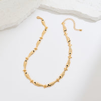 Vintage Fish Link Necklace featuring detailed gold-plated fish links connected in a playful vintage-inspired chain design.
