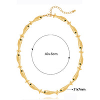 Vintage Fish Link Necklace featuring detailed gold-plated fish links connected in a playful vintage-inspired chain design.
