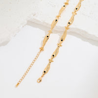 Vintage Fish Link Necklace featuring detailed gold-plated fish links connected in a playful vintage-inspired chain design.
