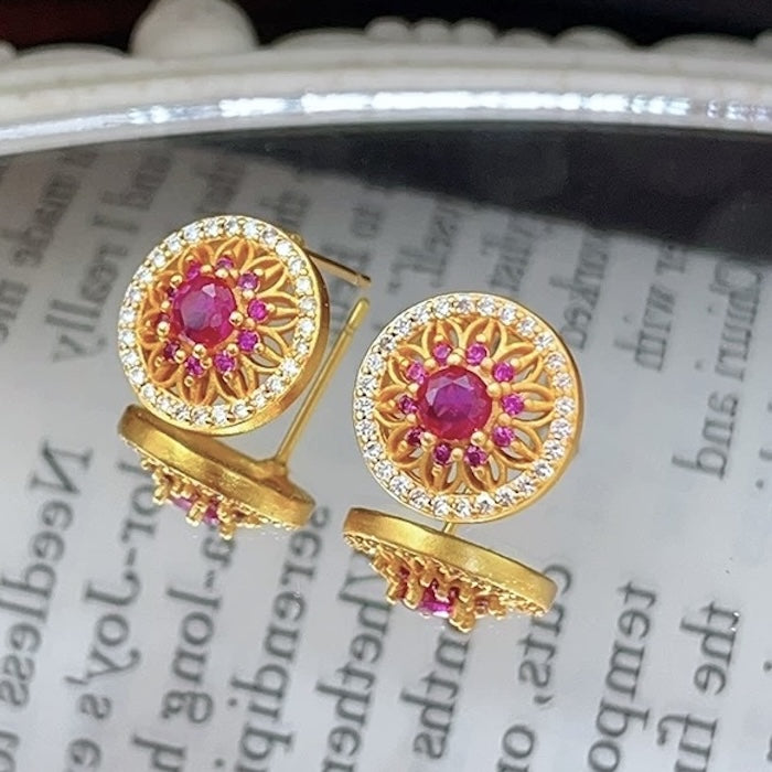 Vintage Style Halo Crystal Stud Earrings featuring a sparkling halo of zirconias surrounding a ruby red or sky blue center stone in a gold-tone vintage-inspired setting.
