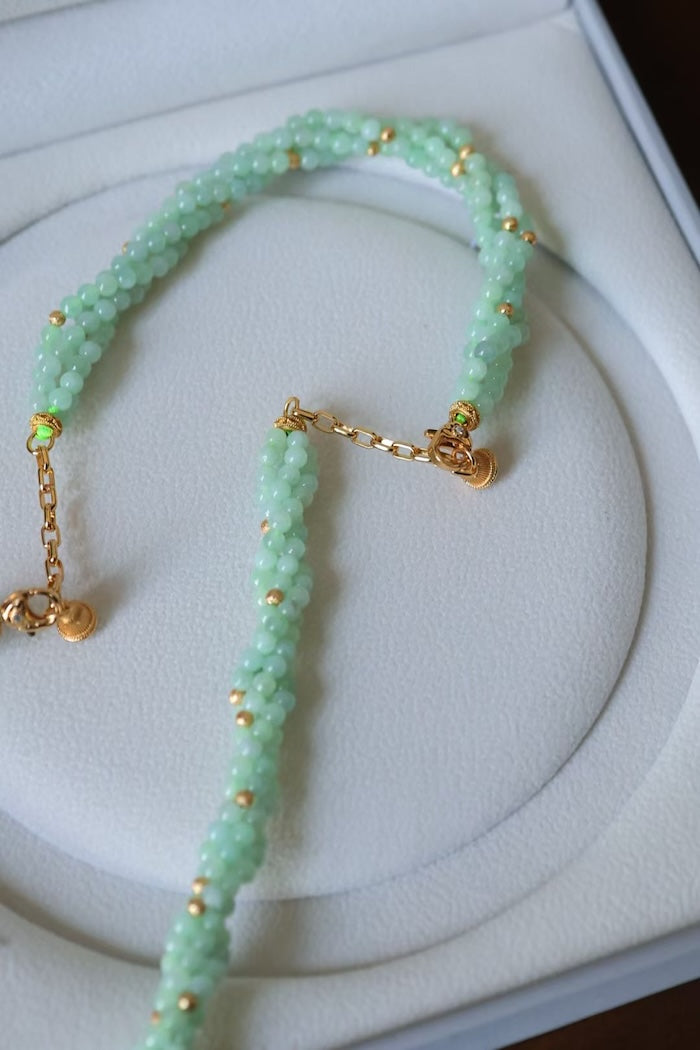 Lucky Jade Braided Necklace and Bracelet Set featuring genuine jade beads in an intricate braided design with gold-tone accents, convertible into a longer necklace.