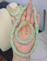 Lucky Jade Braided Necklace and Bracelet Set featuring genuine jade beads in an intricate braided design with gold-tone accents, convertible into a longer necklace.
